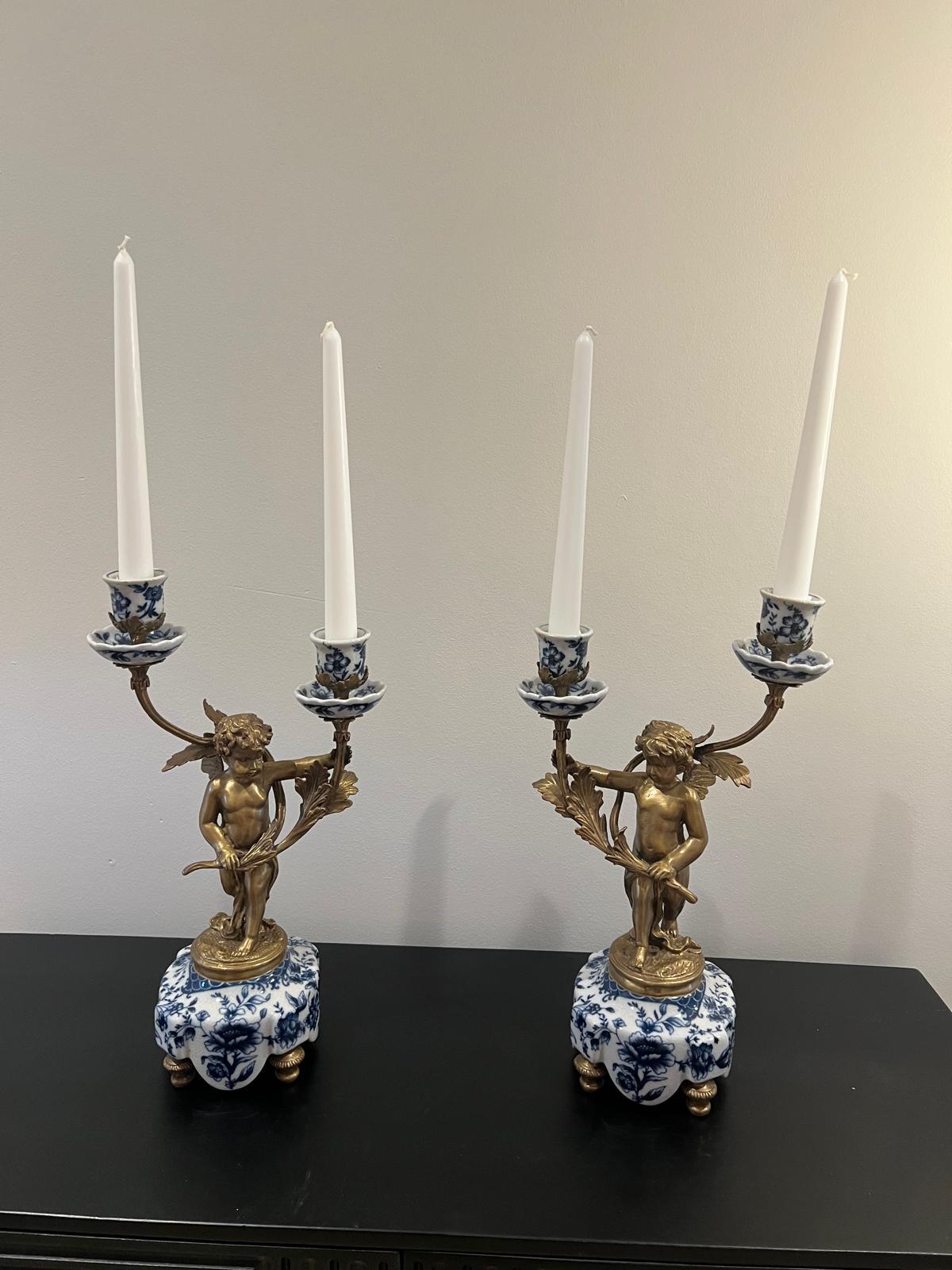 Ornate Cherub Candelabra Pair – Gilt Metal with Blue & White Porcelain Bases