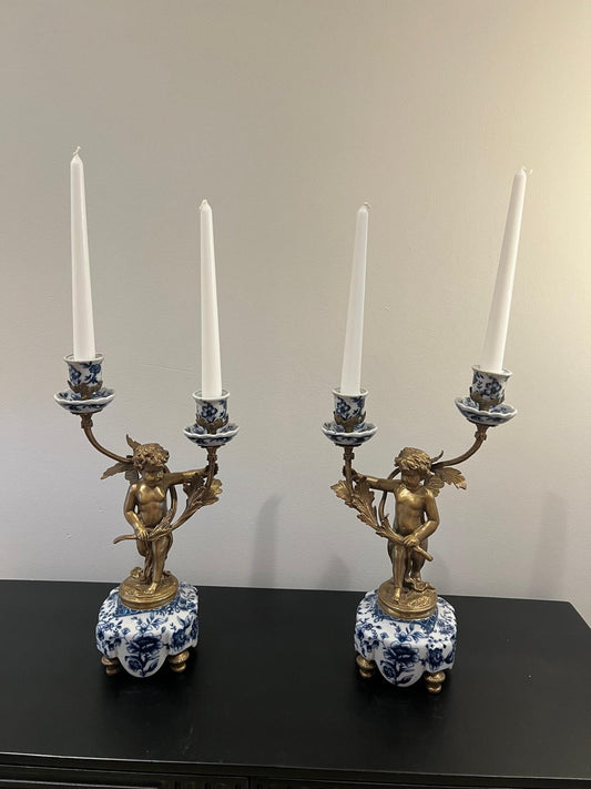 Ornate Cherub Candelabra Pair – Gilt Metal with Blue & White Porcelain Bases