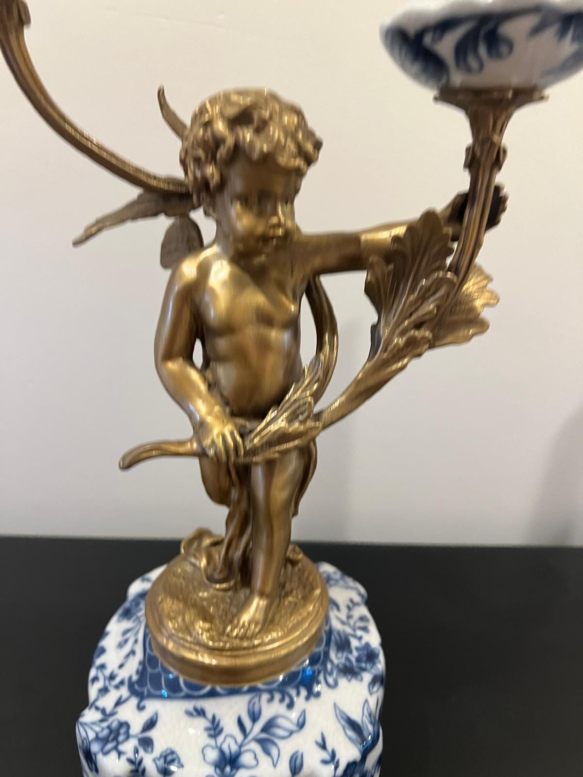 Ornate Cherub Candelabra Pair – Gilt Metal with Blue & White Porcelain Bases
